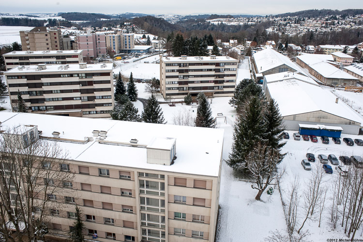 View of the building No. 50, route de Fribourg and of the Saint-Sacrement section from the building at n°33, la route du Centre / © 