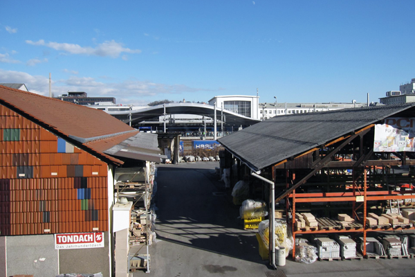 To the East: project site (front) and train station (back)