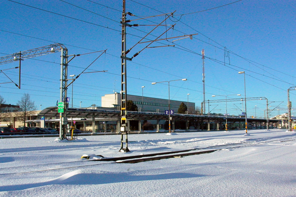 Train station approached from the tracks / © 